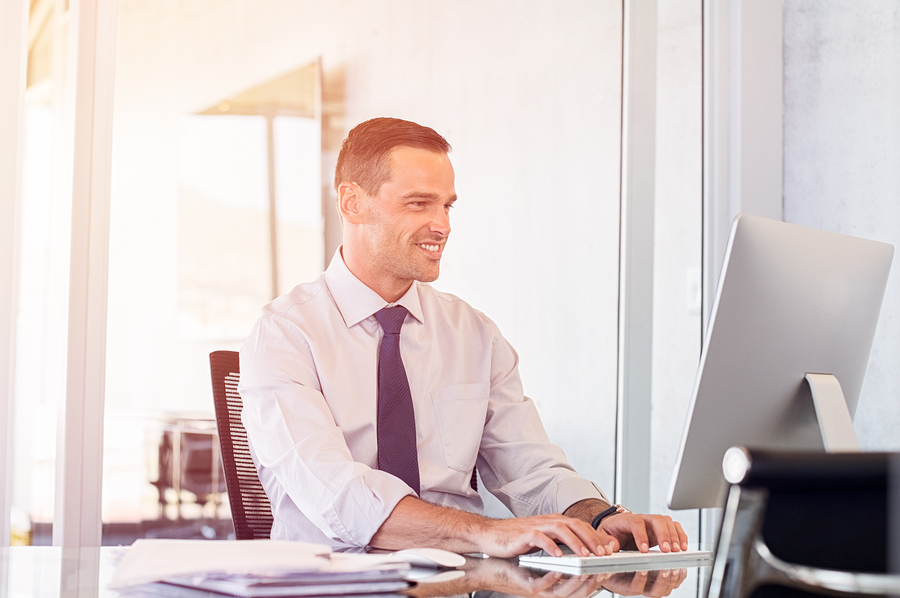 Colorado IT businessman working on desktop computer